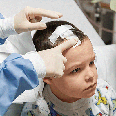 Image of a young child patient receiving medical care.
