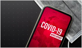 COVID-19 News Update text on a smartphone