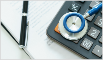 a stethoscope on top of a calculator