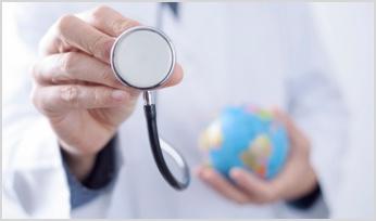 a doctor holding a stethoscope and a globe