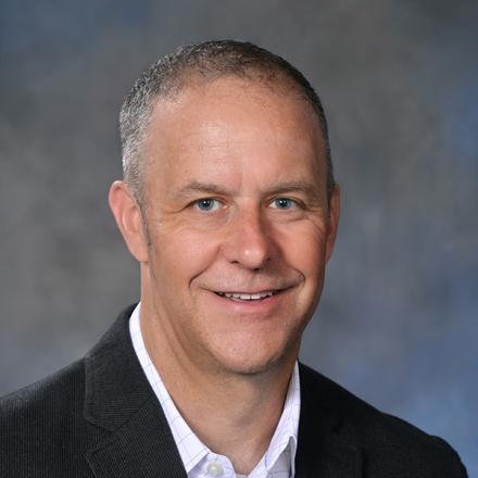 headshot of Benjamin Deneen, Ph.D.