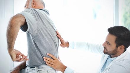 Patient being examined by doctor for sciatica pain.