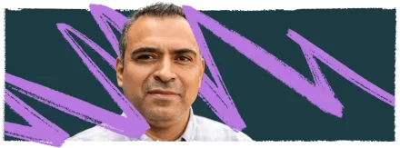 Latino male with white shirt looking straight ahead.