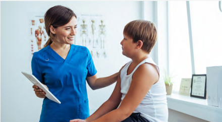 Young boy and clinician in a medical clinic