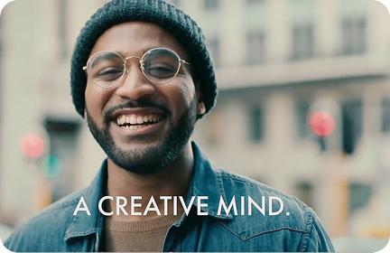 Video thumbnail featuring a young man smiling and the words “a creative mind” in typography