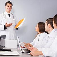 Multinational interns and professor cooperating