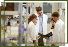 photo of scientists talking in a lab