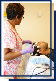 a nurse giving an electroencephalogram (EEG) test to a patient