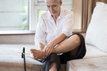 woman with a cramp in her foot