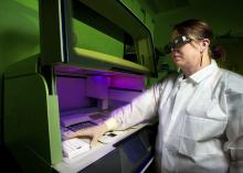 researcher using whole genome sequencer