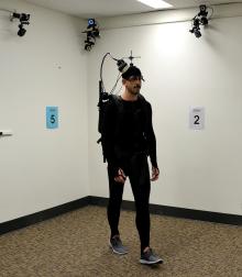 Picture of epilepsy patient wearing a special brain wave monitoring backpack and searching for a hidden spot.