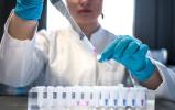 scientist pipetting