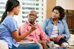 Healthcare professional speaking with African American couple about the risk of stroke